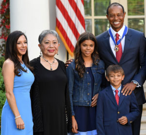 Professional golfer Tiger Woods stands with, From Left, his girlfriend Erica Herman, mother Kultida Woods, Daughter Sam Alexis Woods and son Charlie Axel Woods. Photo: Getty Images