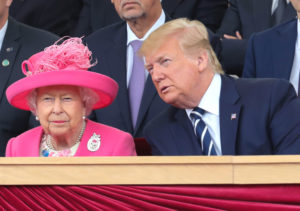 Queen Elabeth Wearing A Pink Suit and Hat With Donald Trump in Blue Suit, White Shirt and Blue and White Striped Tie