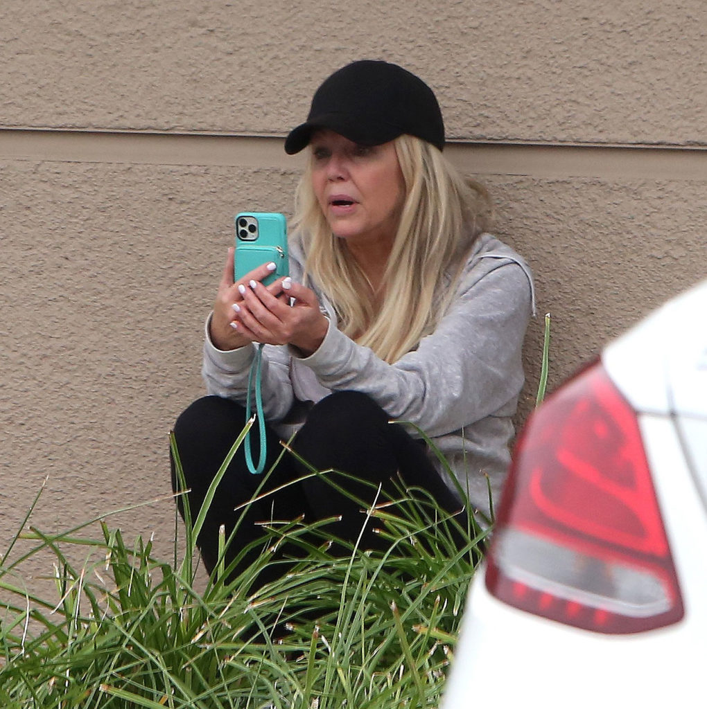 Heather Locklear FaceTiming In Parking Lot Wearing Gray Sweatshirt and Black Baseball Cap, Heather Locklear Caught Popping Pills